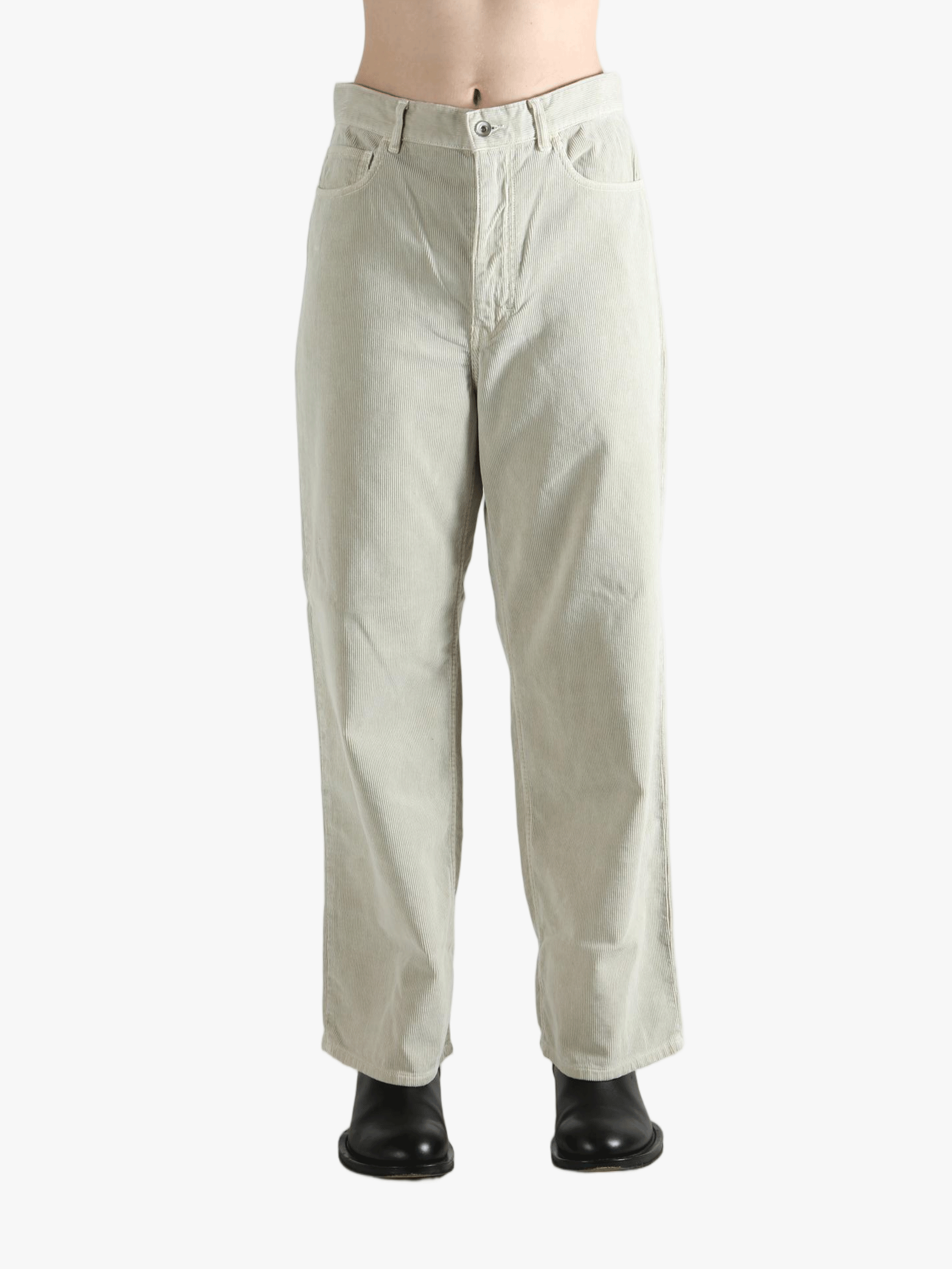 White pants worn by a person, showing the pants' fit