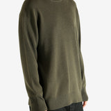 Crew knitwear worn by a person, showing the knitwear's fit