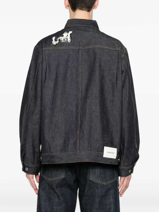 Blue jacket worn by a person, showing the  jacket fit