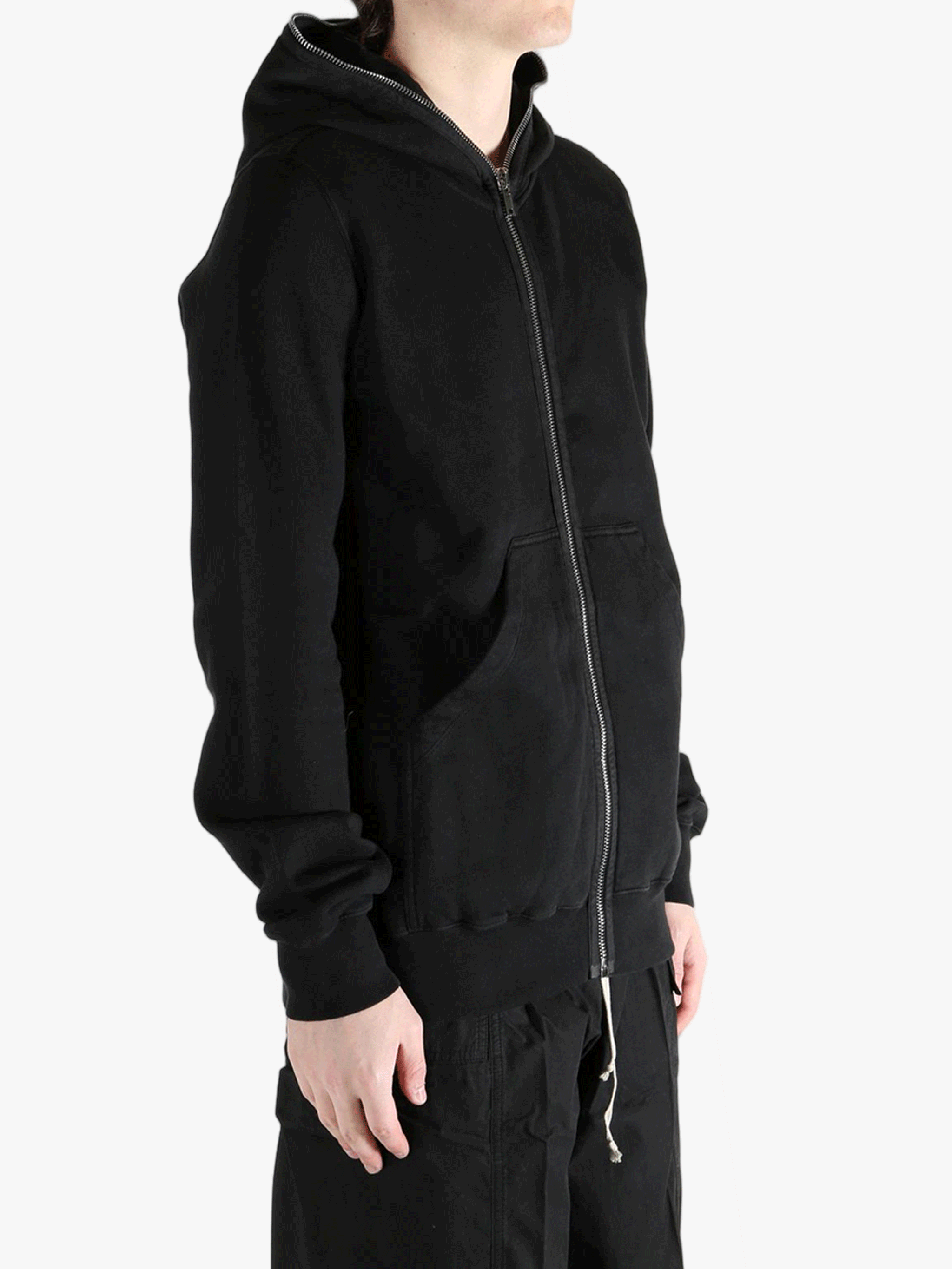 Black hoodie worn by a person, showing the hoodie fit