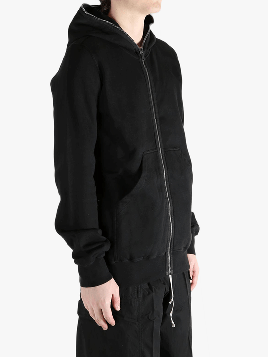Black hoodie worn by a person, showing the hoodie fit