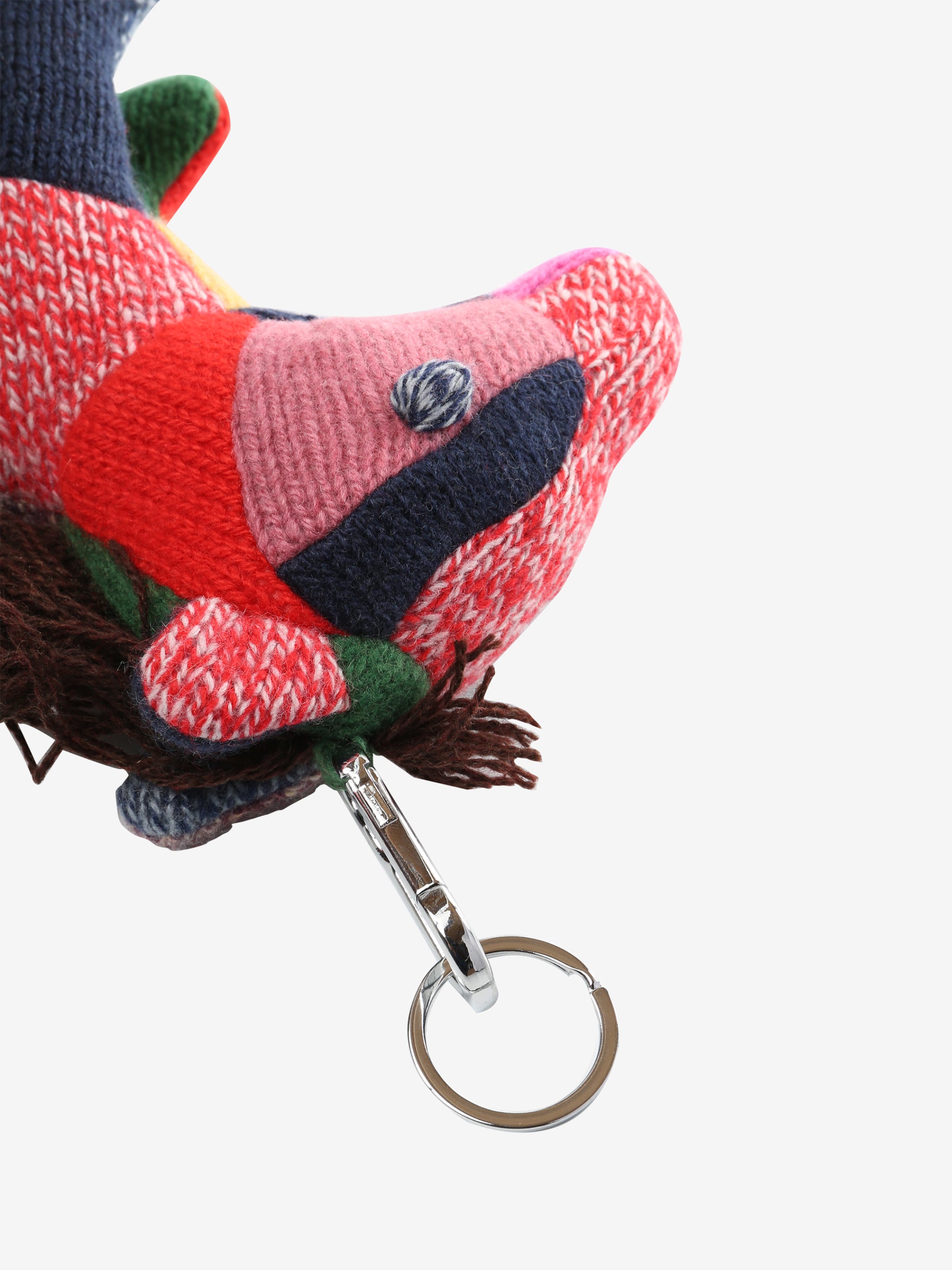 Close up of green keychain, showing texture of the fabric