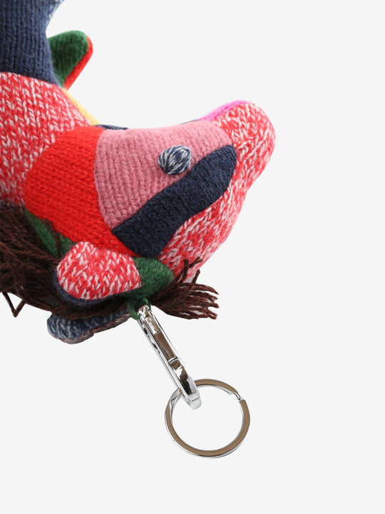 Close up of green keychain, showing texture of the fabric