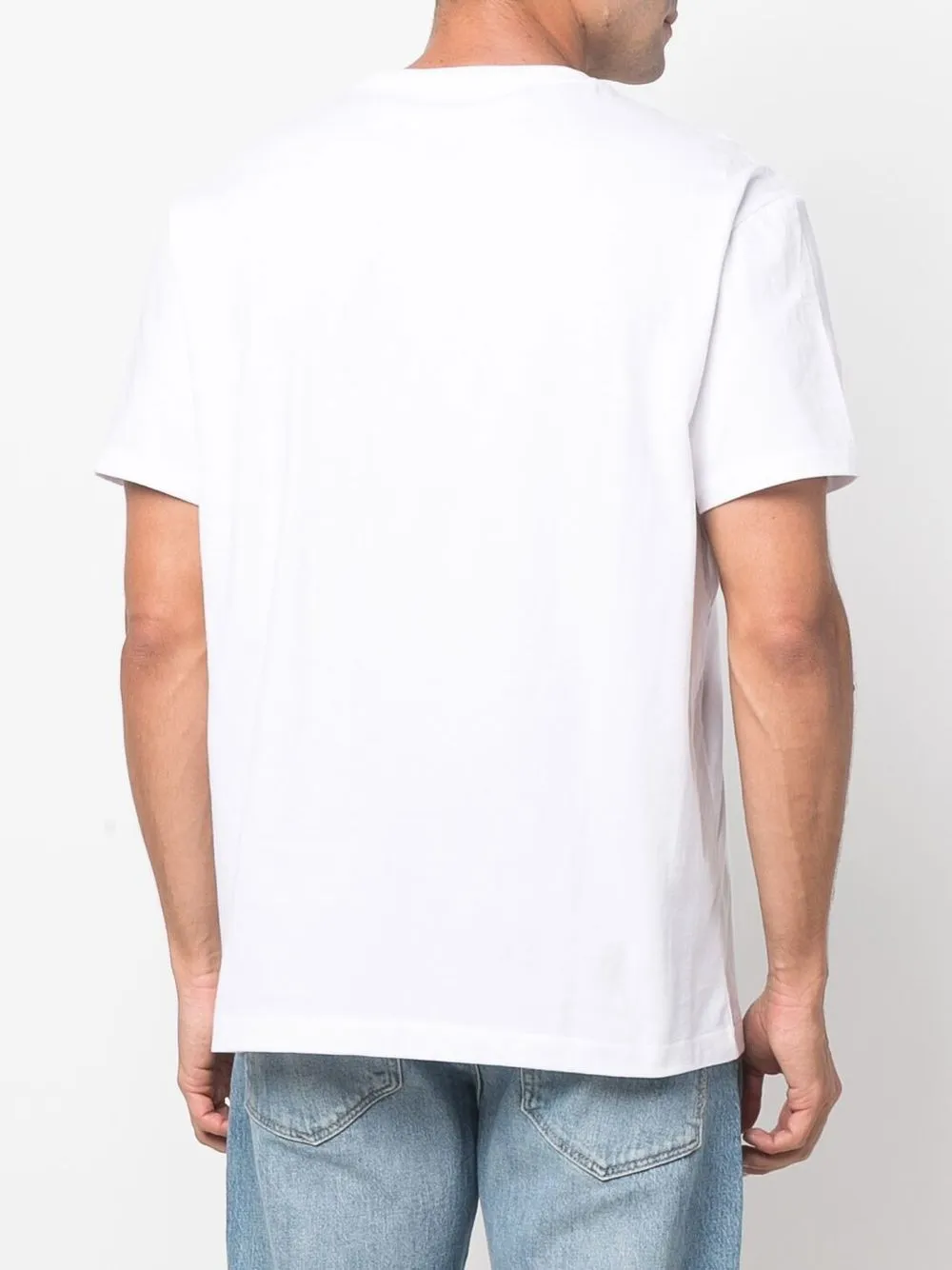 White shirt worn by a person,showing the shirt's fit