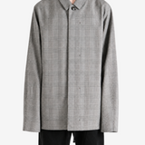 Grey jacket worn by a person, showing the jacket fit