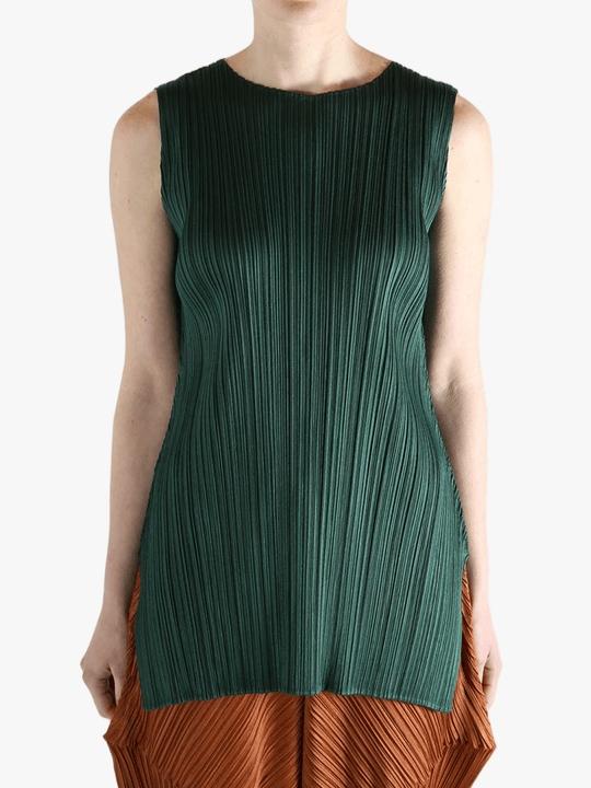 Green dress worn by a person, showing the dress's fit