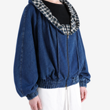 Blue jacket worn by a person, showing the jacket fit