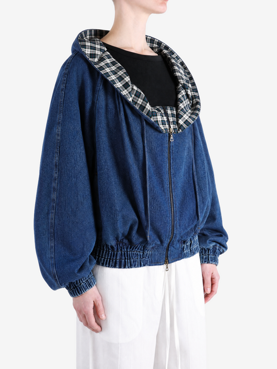 Blue jacket worn by a person, showing the jacket fit