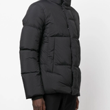 Black coat  worn by a person, showing the coat's fit