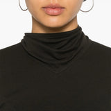 Close up of the brown top, showing texture of the cotton fabric