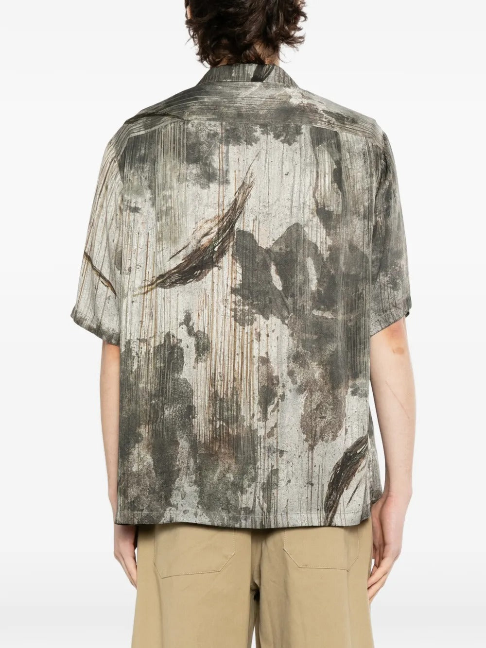 Grey shirts worn by a person, showing the shirts fit