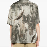 Grey shirts worn by a person, showing the shirts fit