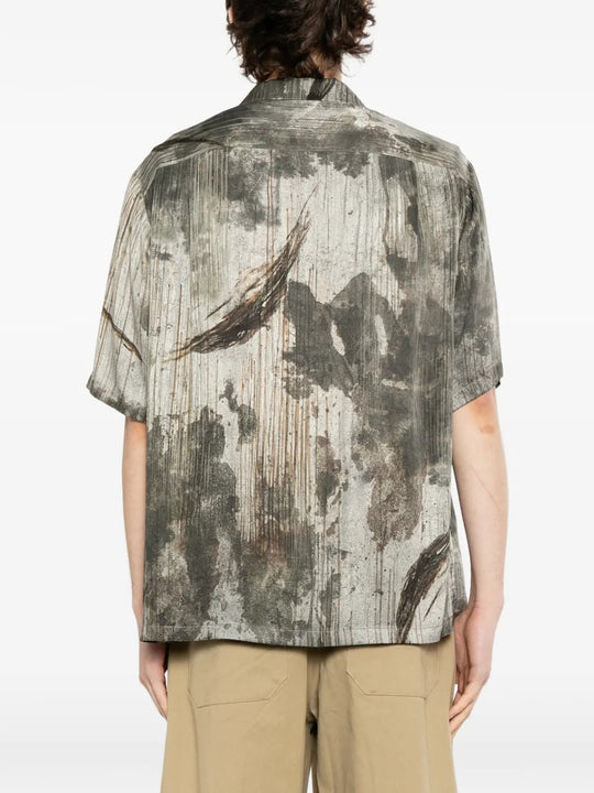 Grey shirts worn by a person, showing the shirts fit