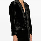 Black jacket worn by a person, showing the jacket fit