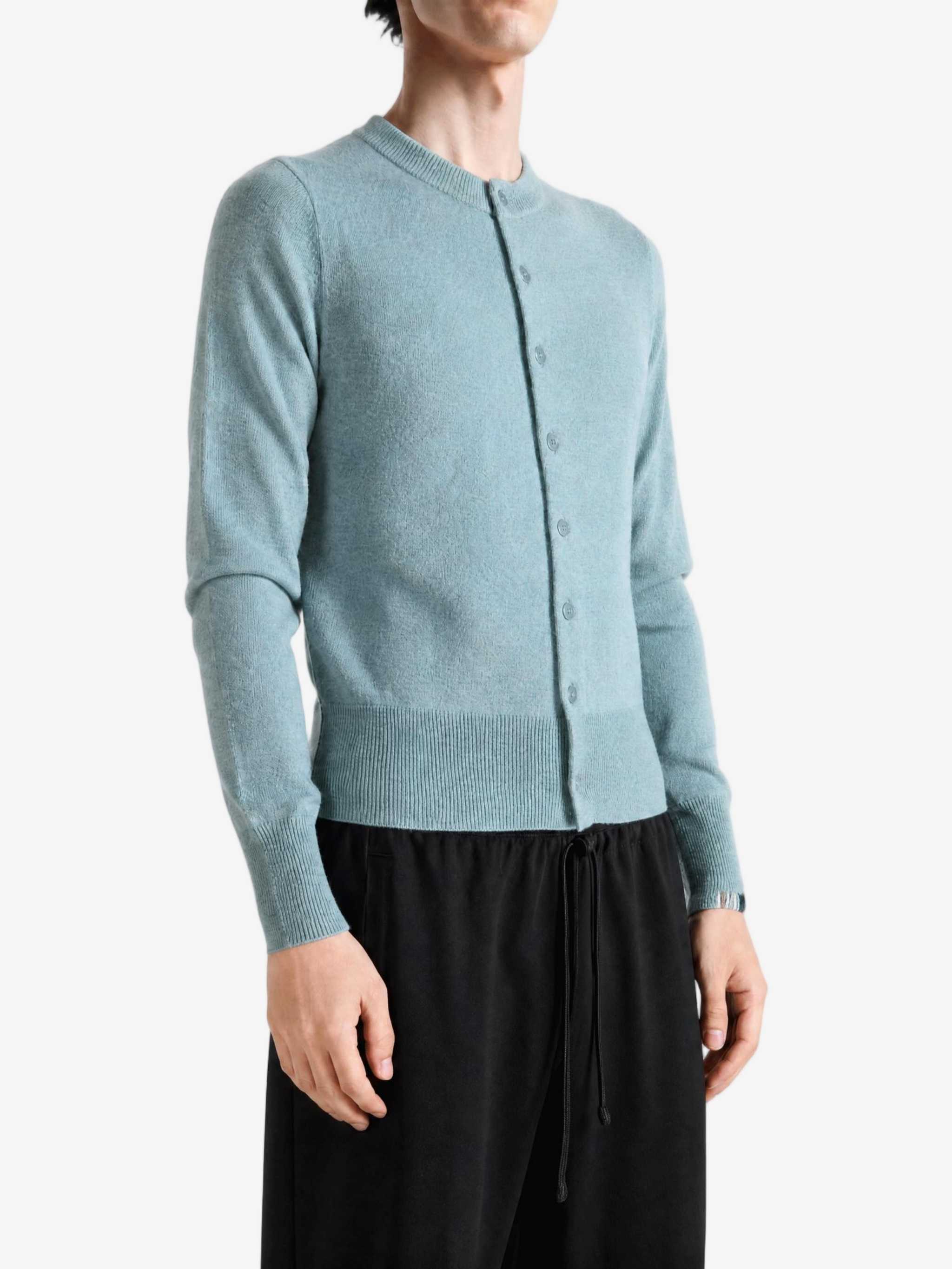 Green hoodie worn by a person, showing the hoodie fit