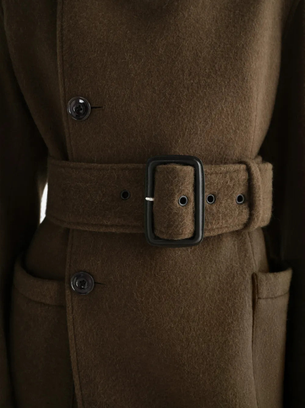 Close up of Brown jacket, showing texture of the 50% wool/ 50% alpaca fabric