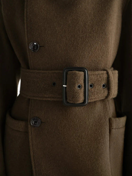 Close up of Brown jacket, showing texture of the 50% wool/ 50% alpaca fabric