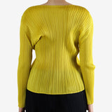 Yellow top worn by a person, showing the top fit