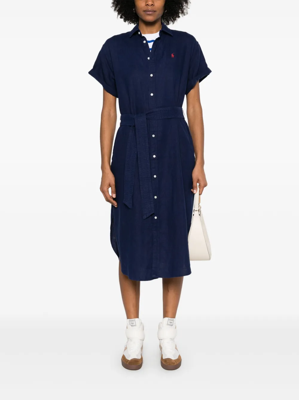 Navy dress worn by a person, showing the dress 's fit