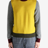 Grey knitwear worn by a person, showing the knitwear's fit