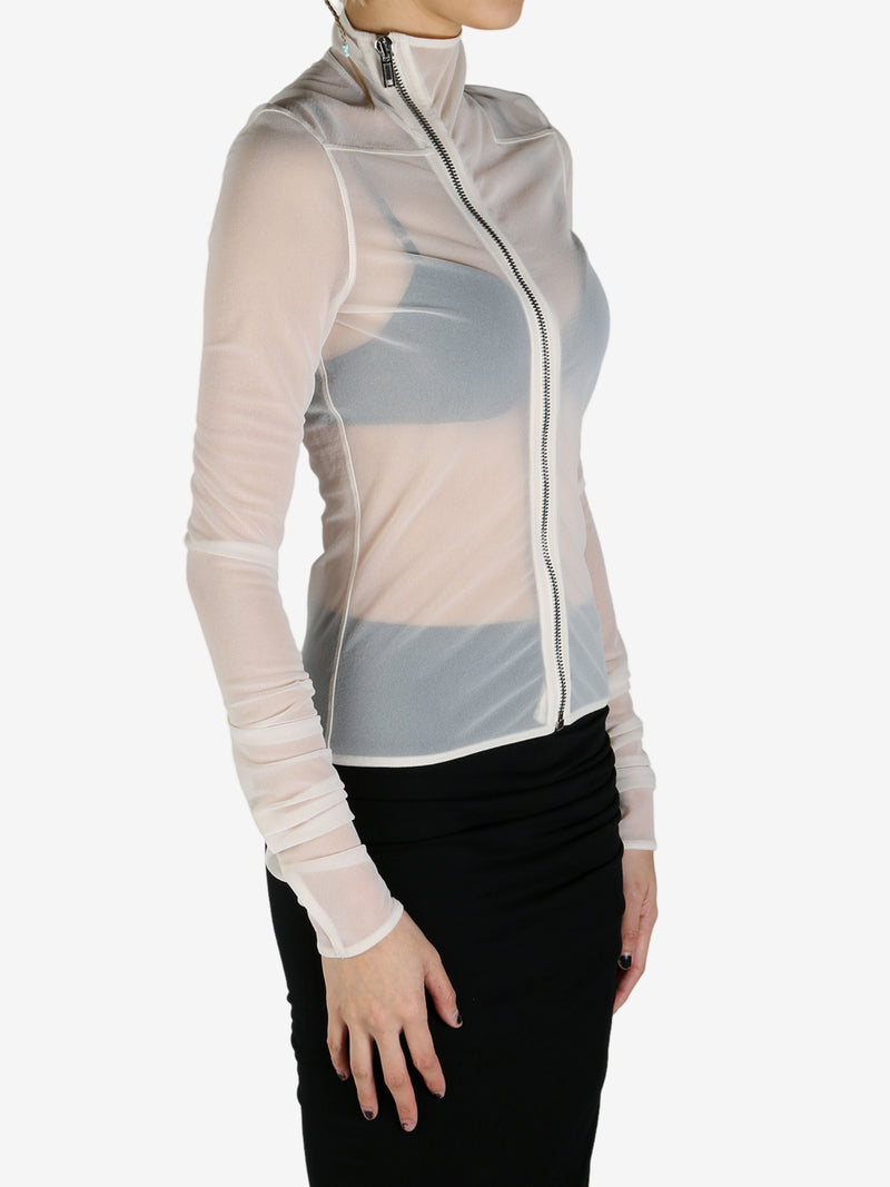 White coat worn by a person, showing the coat's fit