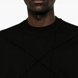 Black t-shirt worn by a person, showing the t-shirt fit