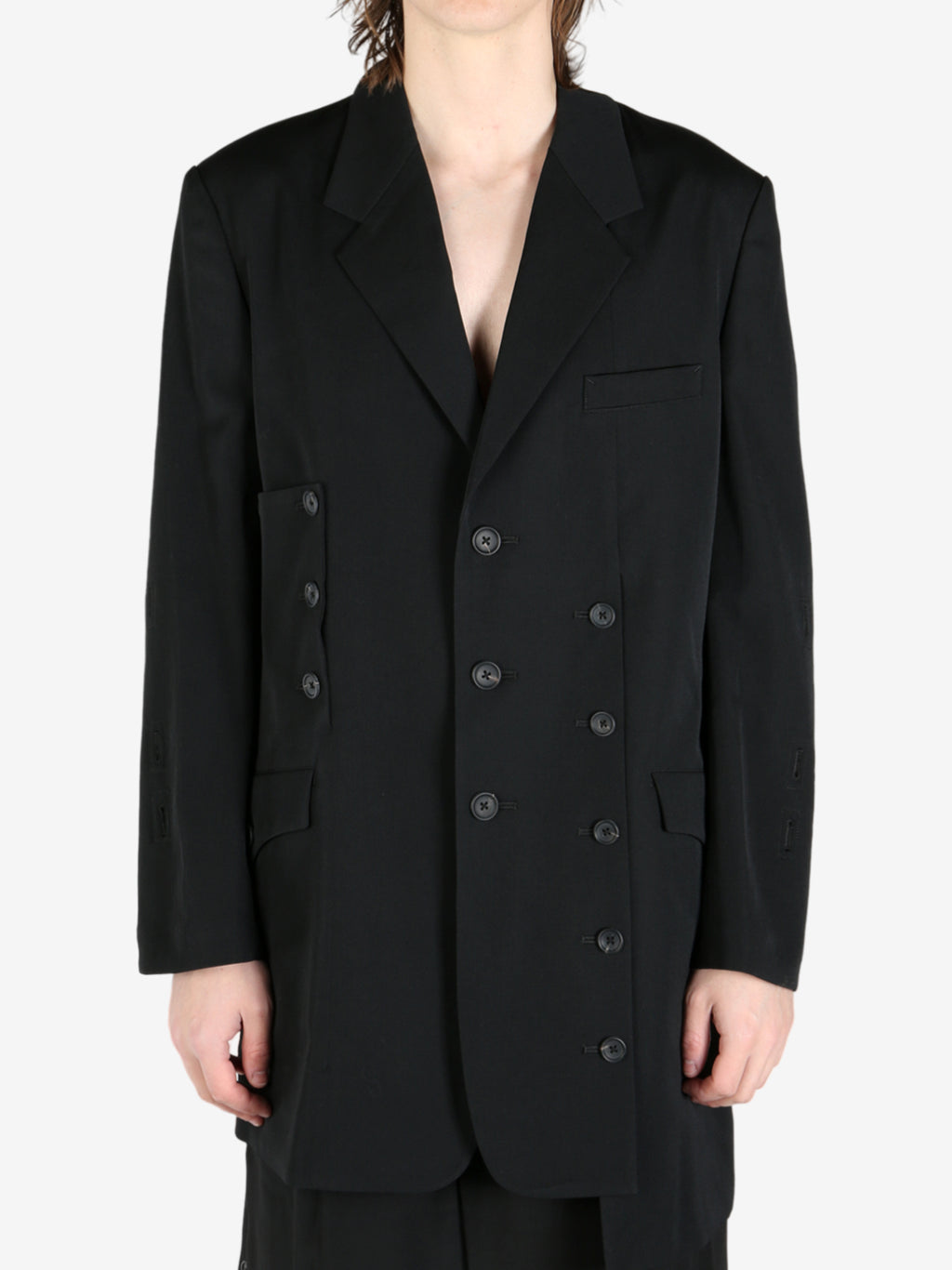 Black jacket worn by a person, showing the jacket's fit