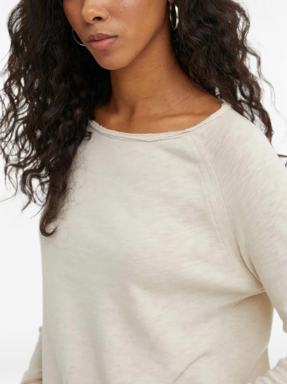 Tan t-shirt worn by a person, showing the t-shirt fit