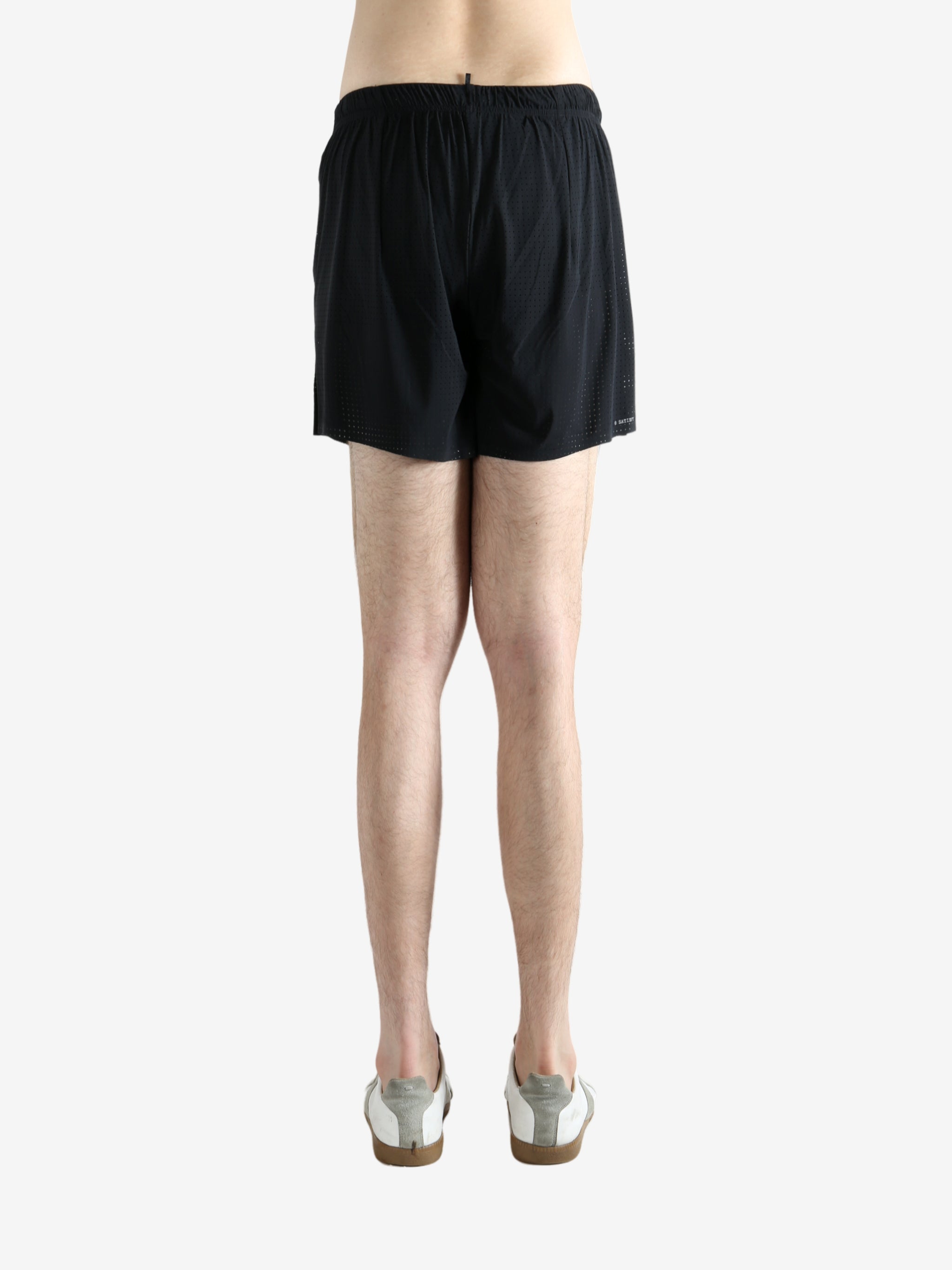 Black shorts worn by a person, showing the shorts' fit