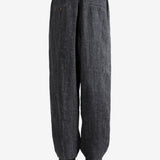 Black pants,worn by a person, showing the pants's fit