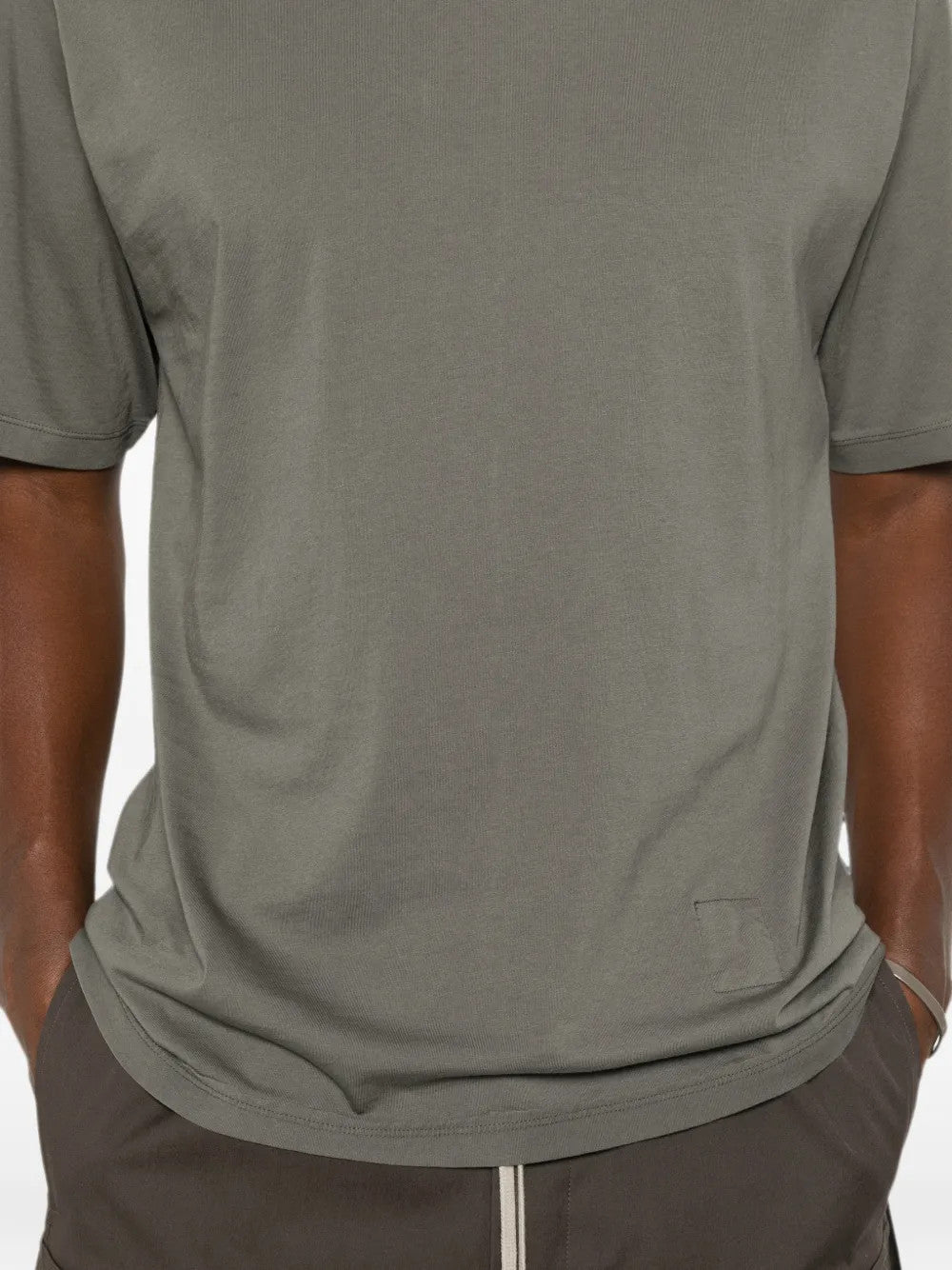 Grey t-shirt worn by a person, showing the t-shirt fit