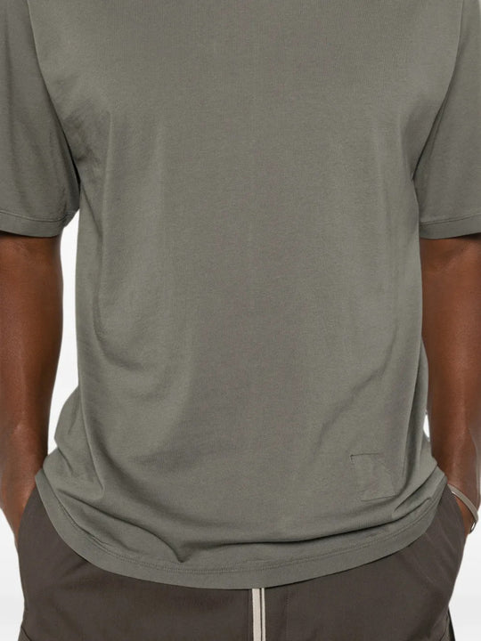 Grey t-shirt worn by a person, showing the t-shirt fit