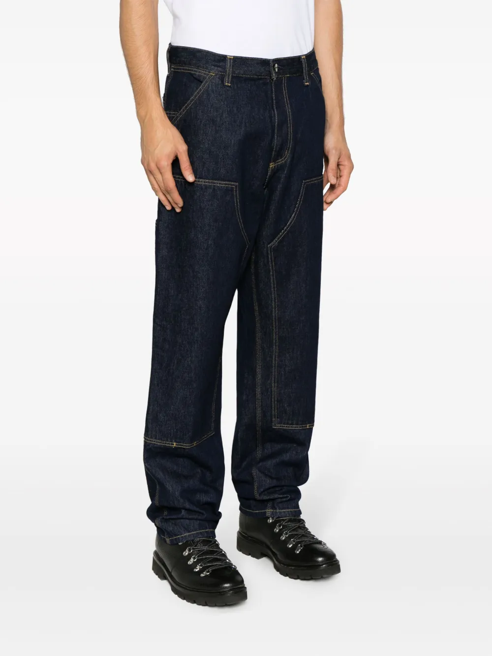 Black pants worn by a person, showing the pants fit