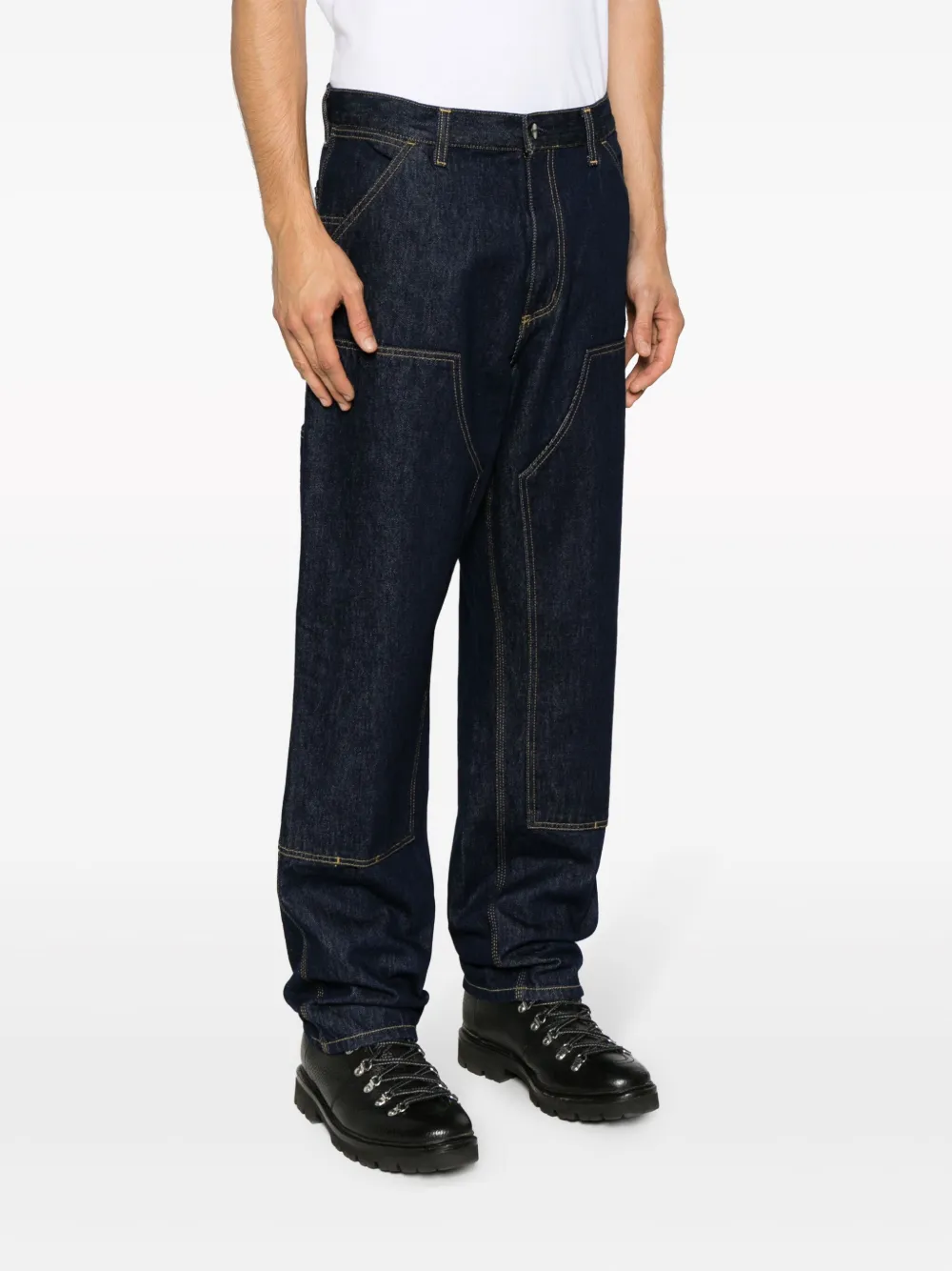 Black pants worn by a person, showing the pants fit