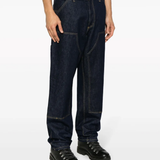Black pants worn by a person, showing the pants fit