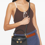 Black bag worn by a person, showing the bag fit