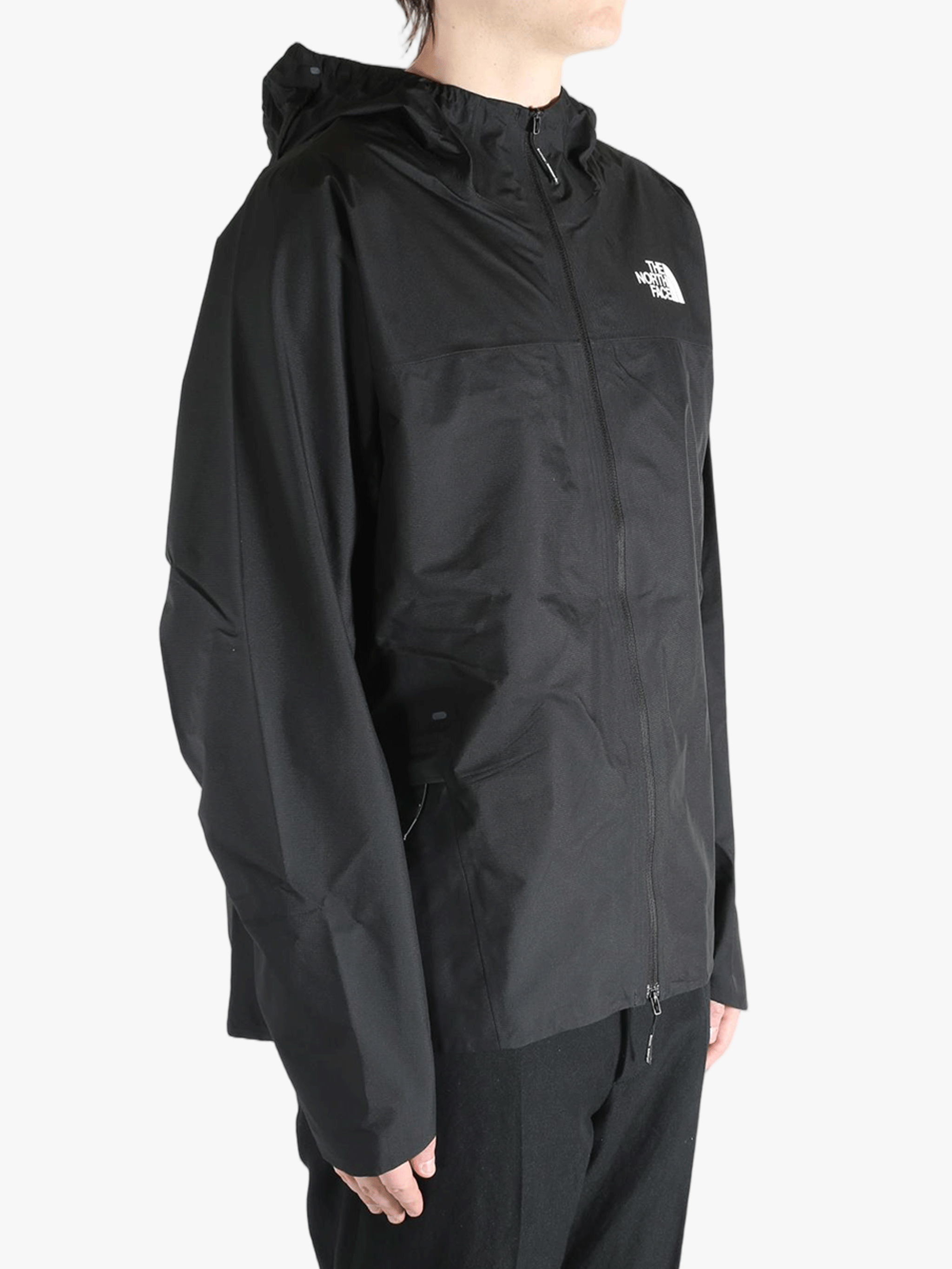 Black jacket worn by a person, showing the jacket's fit