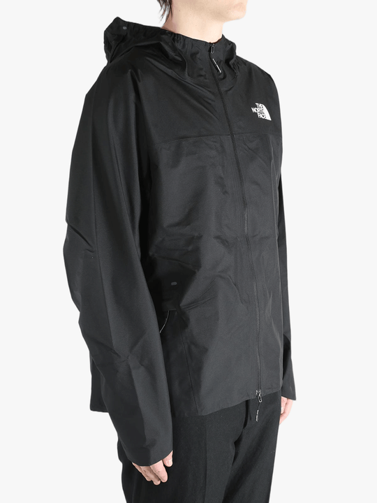 Black jacket worn by a person, showing the jacket's fit