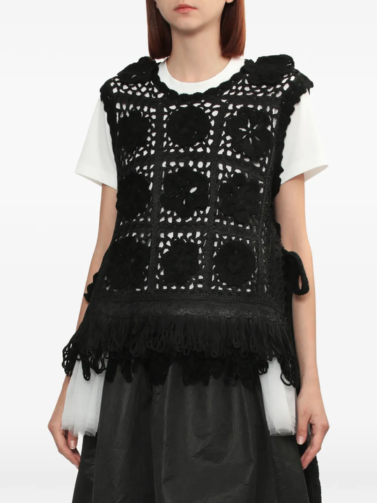 black top worn by a person, showing the top fit