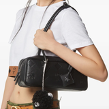 Black bag worn by a person, showing the bag's fit