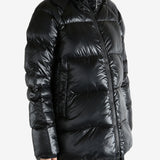 Black coat worn by a person, showing the coat's fit