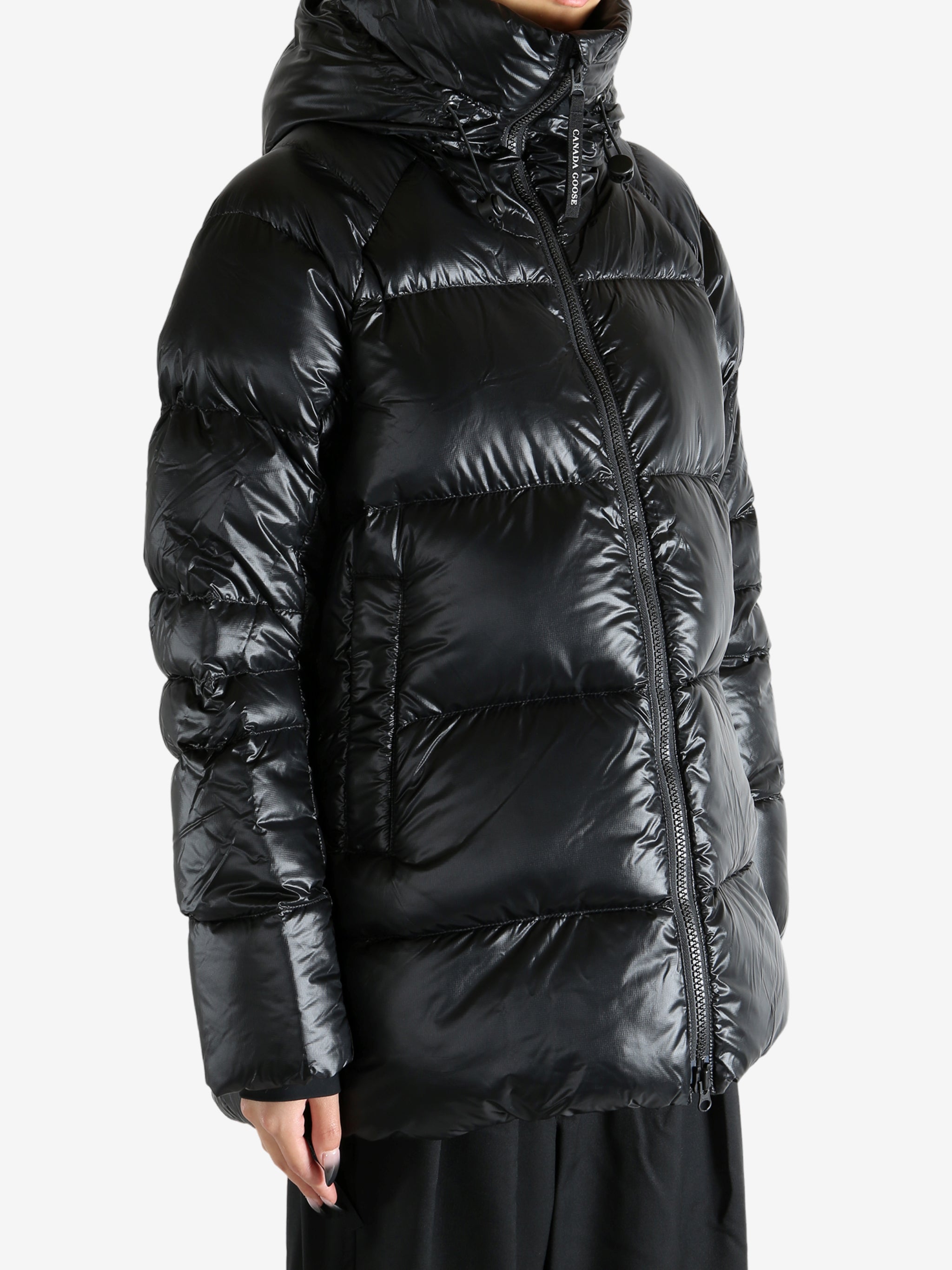 Black coat worn by a person, showing the coat's fit