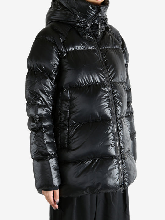 Black coat worn by a person, showing the coat's fit