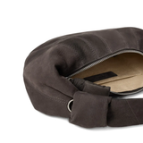 Close up of brown bag, showing the detail of the inner pocket