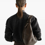 Brown bag worn by a person, showing the bag fit