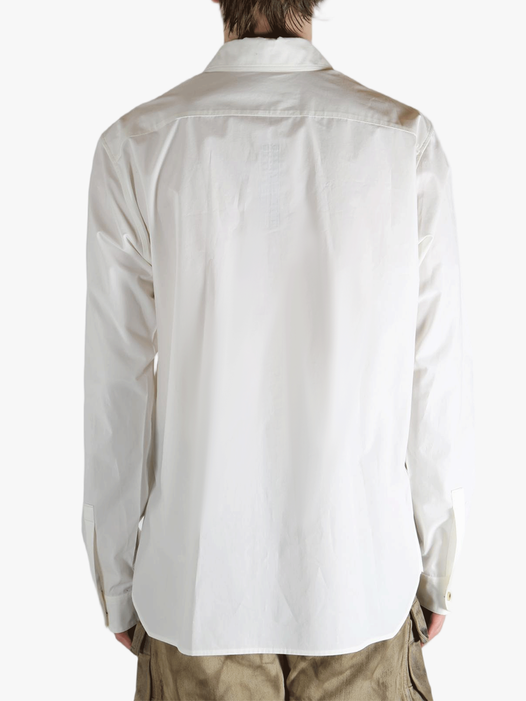 White shirt worn by a person, showing the shirt's fit