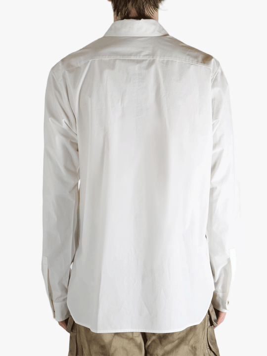 White shirt worn by a person, showing the shirt's fit