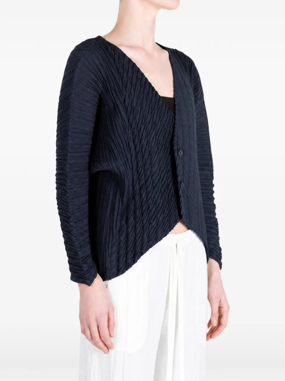 Navy knitwear worn by a person, showing the knitwear fit