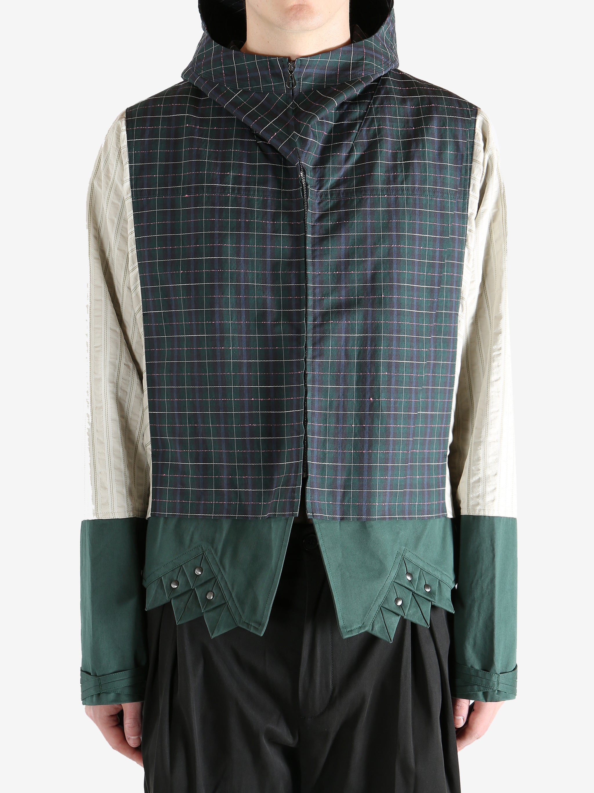 Green jacket worn by a person, showing the jacket's fit