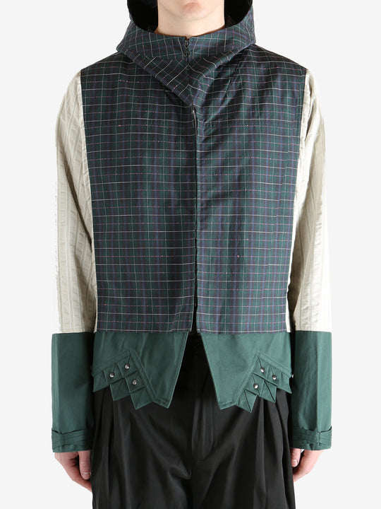 Green jacket worn by a person, showing the jacket's fit